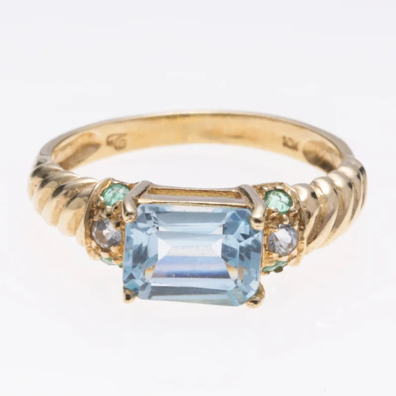 Big Savings On Your Favorite Jewelry Pieces 10K Yellow Gold Aquamarine Emerald Topaz Ring | 1.27ct, 0.05ctw, 0.06ctw | SZ 7 Big Savings On Your Favorite Jewelry Pieces 10K Yellow Gold Aquamarine Emerald Topaz Ring | 1.27ct, 0.05ctw, 0.06ctw | SZ 7