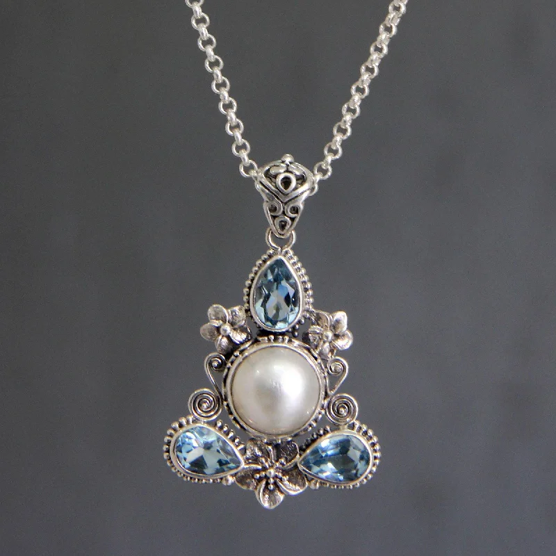 Unmissable Discounts On Timeless Jewelry Pieces Frangipani Blue Topaz & Pearl Pendant Necklace Unmissable Discounts On Timeless Jewelry Pieces Frangipani Blue Topaz & Pearl Pendant Necklace